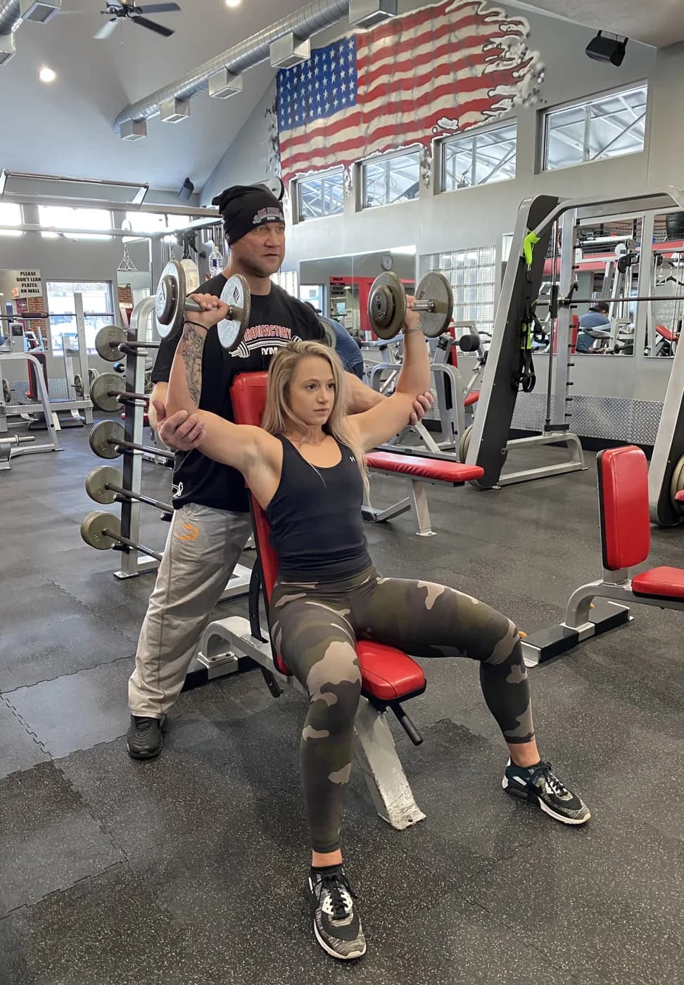 Dave Gratta — IFBB pro and owner of Iron Factory Gym, on the floor coaching